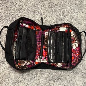 Vera Bradley black toiletry bag with 4 zippered pockets inside. Great condition!